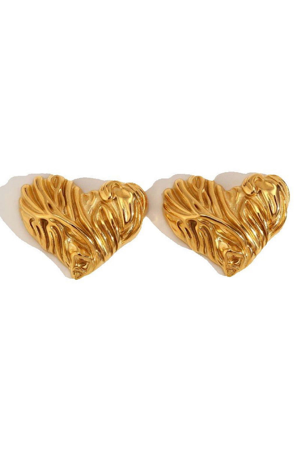 Gold heart-shaped earrings on a white background by House of svarnaa